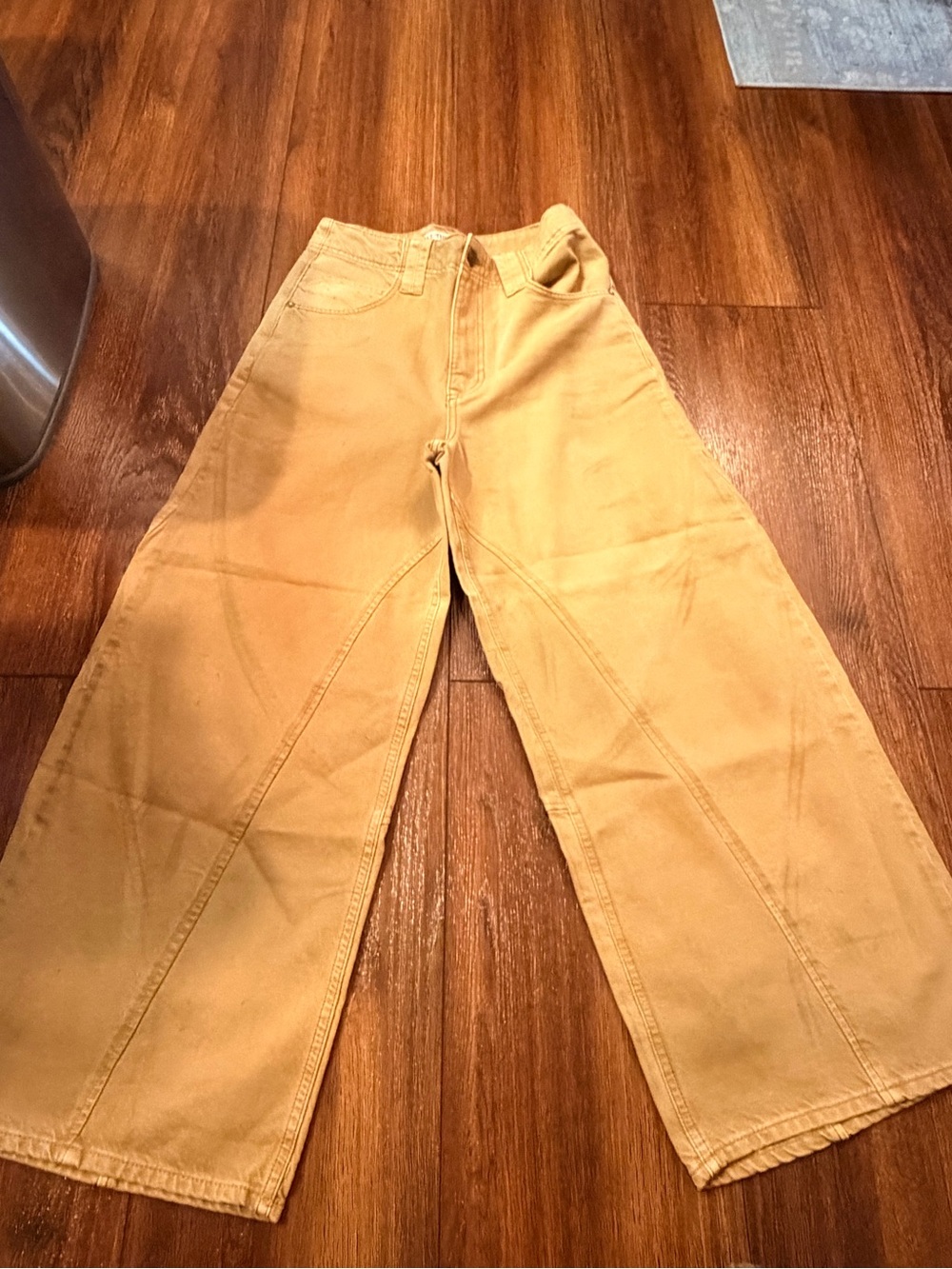 We The Free Wide-Leg Flare Jeans in mustard yellow